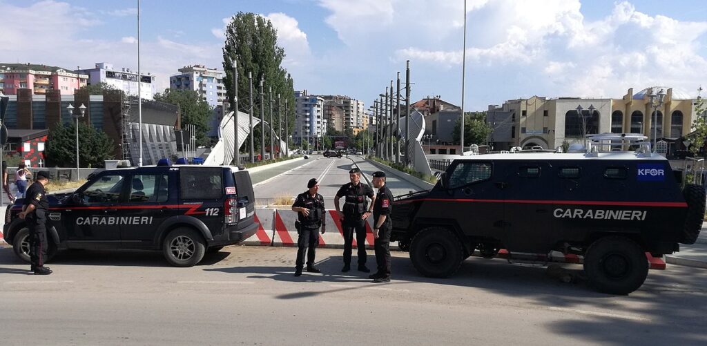 Carabinieri KFOR-MSU patrols in front of Ibar Bridge, in Mitrovica (Kosovo). Summer 2019.